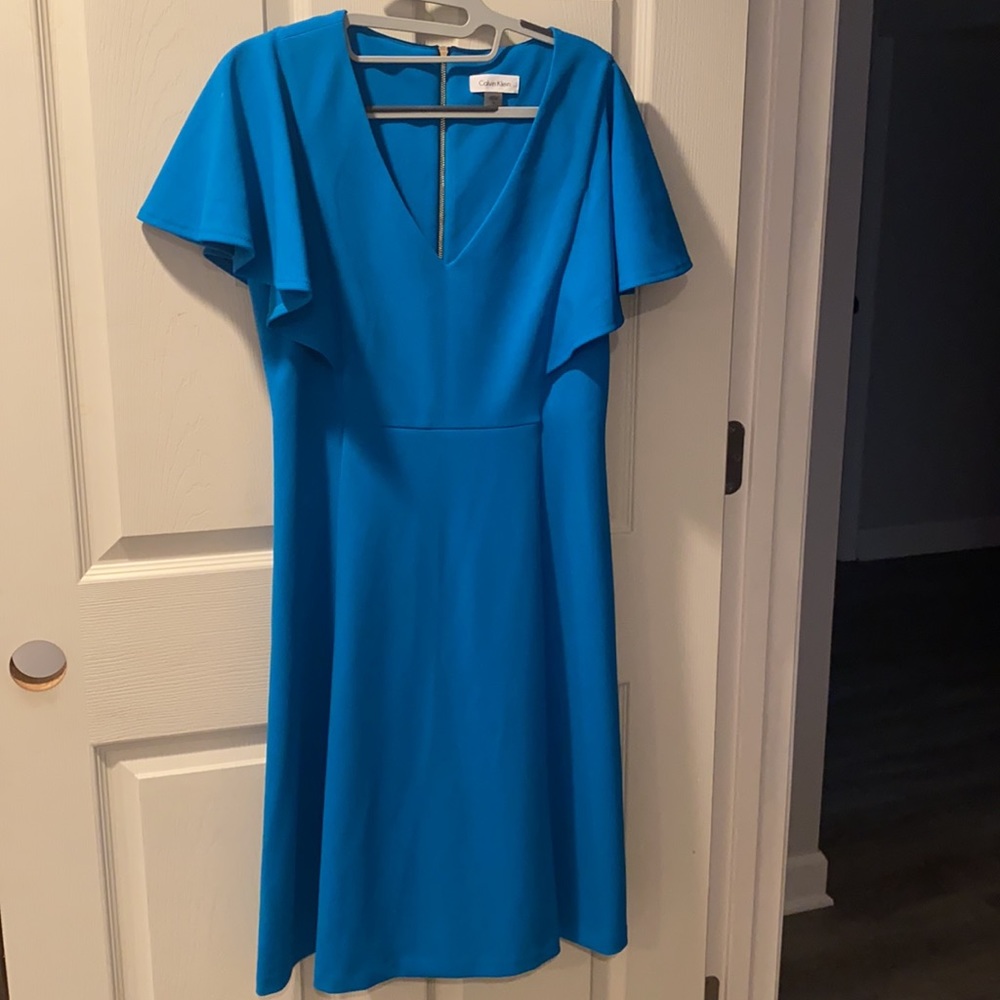 Gently used turquoise Calvin Klein dress.